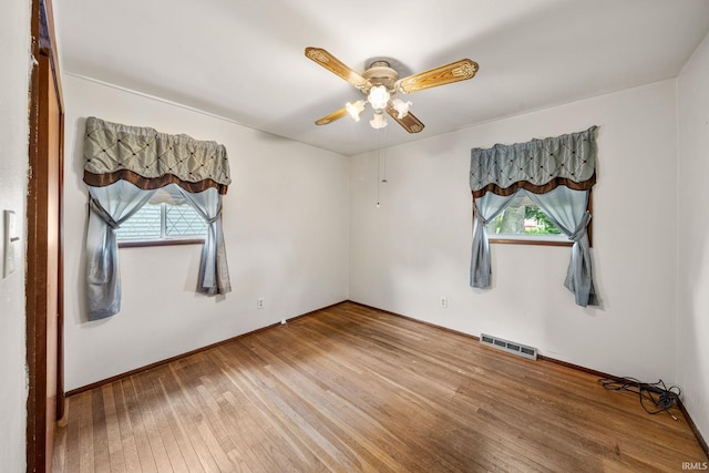 1212 Michigan Ave, Mishawaka, IN 46544 - unfurnished room featuring plenty of natural light, hardwood / wood-style floors, and a ceiling fan