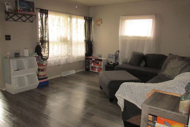 1908 E 18th St, Muncie, IN 47302 - living room featuring wood finished floors and baseboards
