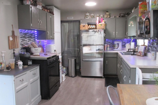 1908 E 18th St, Muncie, IN 47302 - kitchen featuring appliances with stainless steel finishes, tasteful backsplash, and gray cabinets