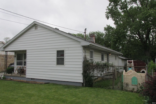 1908 E 18th St, Muncie, IN 47302 - view of side of property with a chimney