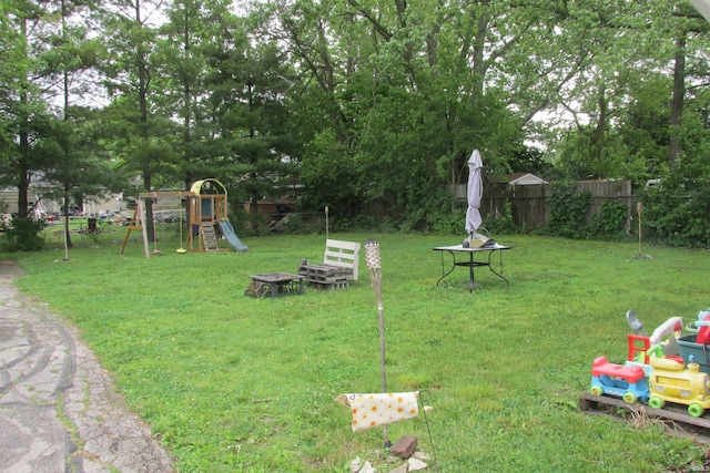 1908 E 18th St, Muncie, IN 47302 - view of yard with a playground and an outdoor fire pit