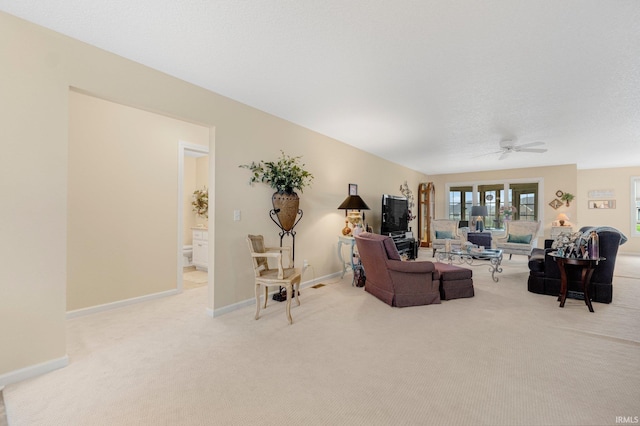 3441 Brantley Dr, New Haven, IN 46774 - carpeted living room featuring baseboards and a ceiling fan