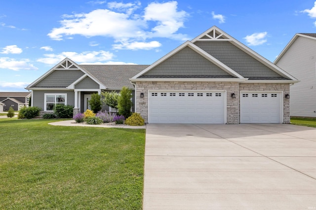 1159 Chesapeake Pointe Dr, Lafayette, IN 47909 - craftsman inspired home with driveway, an attached garage, a front yard, and stone siding
