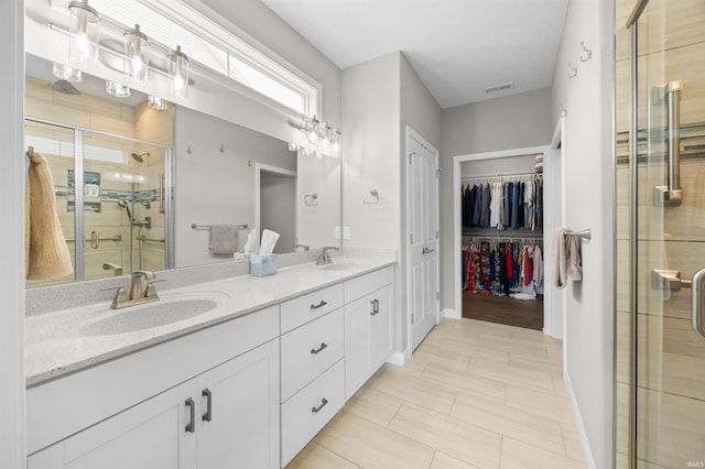 1159 Chesapeake Pointe Dr, Lafayette, IN 47909 - full bath with a shower stall, double vanity, a spacious closet, and baseboards