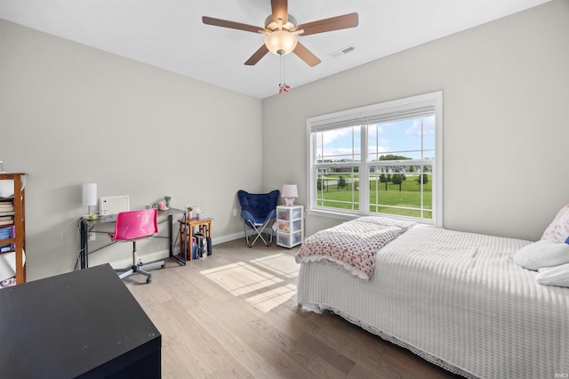 1159 Chesapeake Pointe Dr, Lafayette, IN 47909 - bedroom with wood finished floors, ceiling fan, and baseboards