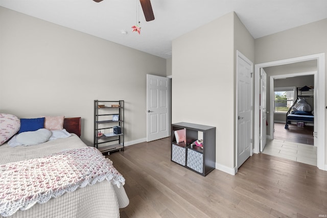 1159 Chesapeake Pointe Dr, Lafayette, IN 47909 - bedroom featuring wood finished floors, ceiling fan, and baseboards