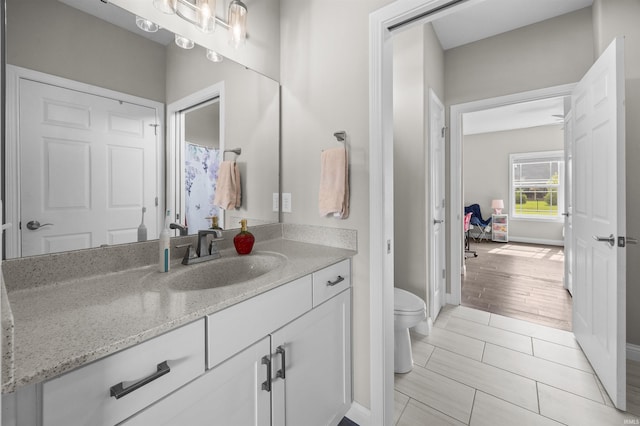 1159 Chesapeake Pointe Dr, Lafayette, IN 47909 - bathroom featuring toilet, vanity, and baseboards