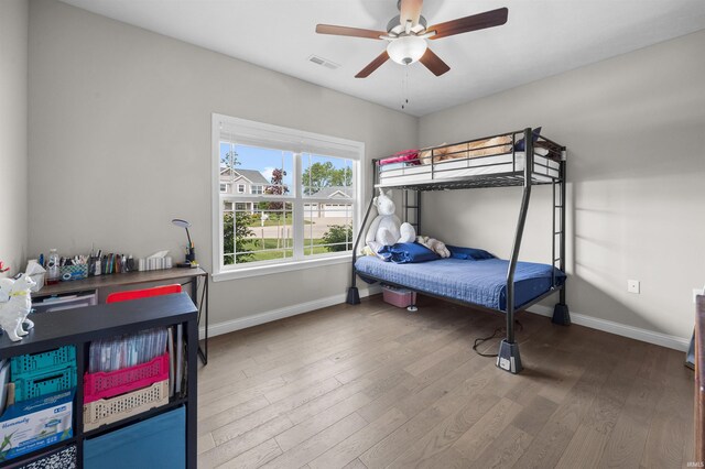 1159 Chesapeake Pointe Dr, Lafayette, IN 47909 - bedroom with baseboards, wood finished floors, and ceiling fan