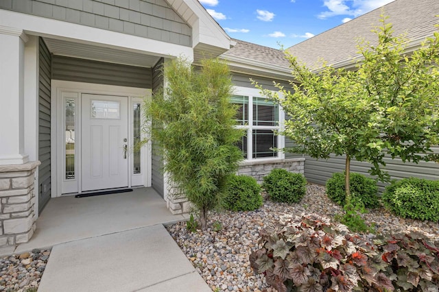 1159 Chesapeake Pointe Dr, Lafayette, IN 47909 - view of exterior entry featuring a shingled roof and stone siding