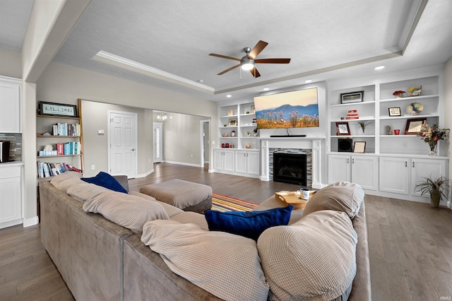 1159 Chesapeake Pointe Dr, Lafayette, IN 47909 - living room with a raised ceiling, a ceiling fan, built in features, wood finished floors, and baseboards
