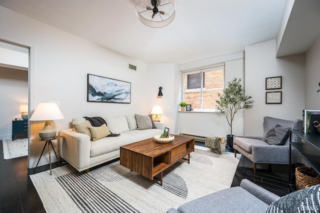 112 W Washington Blvd Unit 232, Fort Wayne, IN 46802 - living area featuring wood finished floors and a baseboard radiator