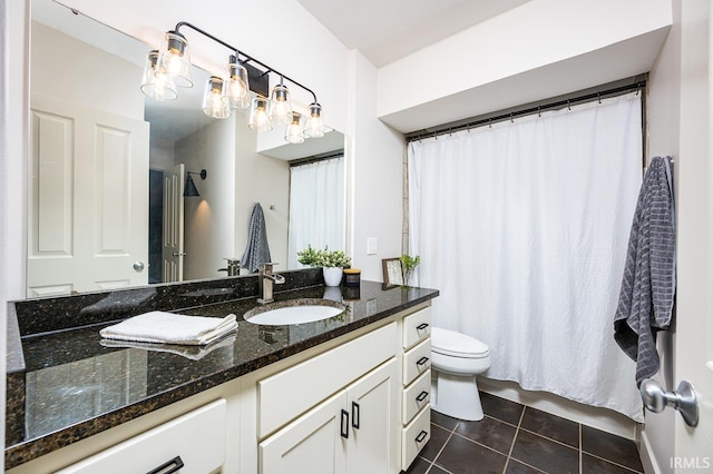 112 W Washington Blvd Unit 232, Fort Wayne, IN 46802 - bathroom featuring tile patterned flooring, vanity, toilet, and a shower with curtain