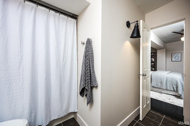 112 W Washington Blvd Unit 232, Fort Wayne, IN 46802 - full bath with tile patterned flooring, baseboards, ensuite bath, a ceiling fan, and a shower with curtain