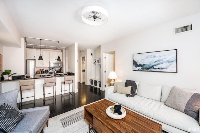 112 W Washington Blvd Unit 232, Fort Wayne, IN 46802 - living area featuring dark wood-style floors and track lighting