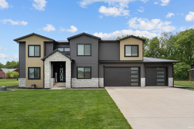 30474 Jaxon Dr, Elkhart, IN 46517 - view of front of home with stone siding, driveway, and a front yard