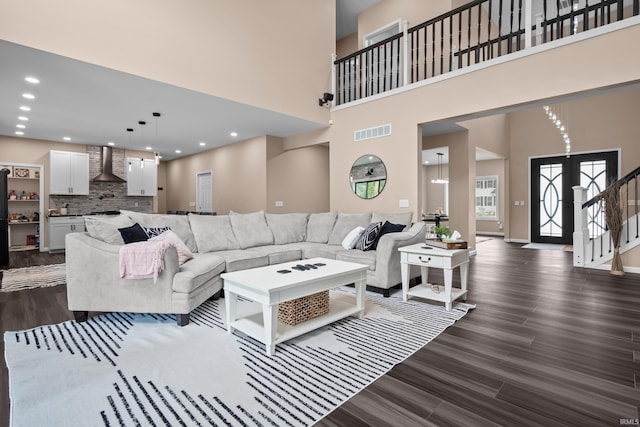 30474 Jaxon Dr, Elkhart, IN 46517 - living room with a high ceiling, dark wood finished floors, baseboards, recessed lighting, and stairs
