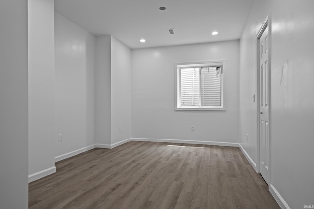 30474 Jaxon Dr, Elkhart, IN 46517 - spare room with wood finished floors, baseboards, and recessed lighting