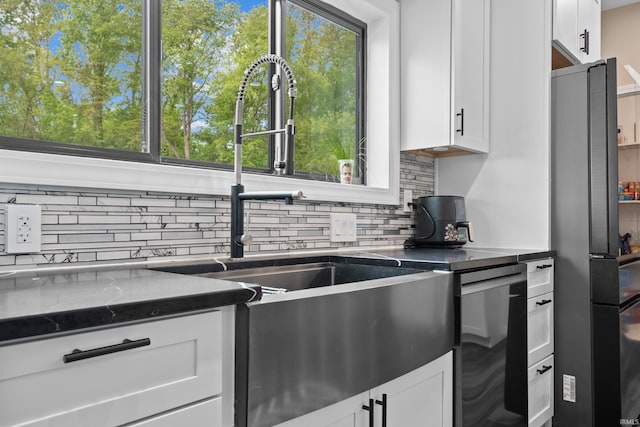 30474 Jaxon Dr, Elkhart, IN 46517 - kitchen with a sink, freestanding refrigerator, tasteful backsplash, and white cabinetry