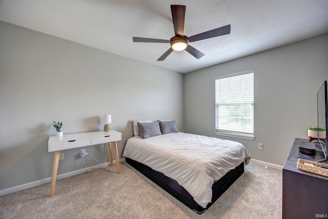 3063 N Natasha Dr, Bloomington, IN 47404 - bedroom featuring baseboards, light colored carpet, and ceiling fan