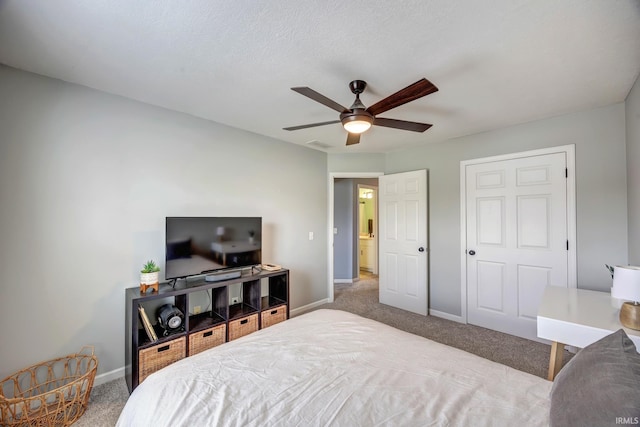 3063 N Natasha Dr, Bloomington, IN 47404 - carpeted bedroom featuring baseboards and a ceiling fan