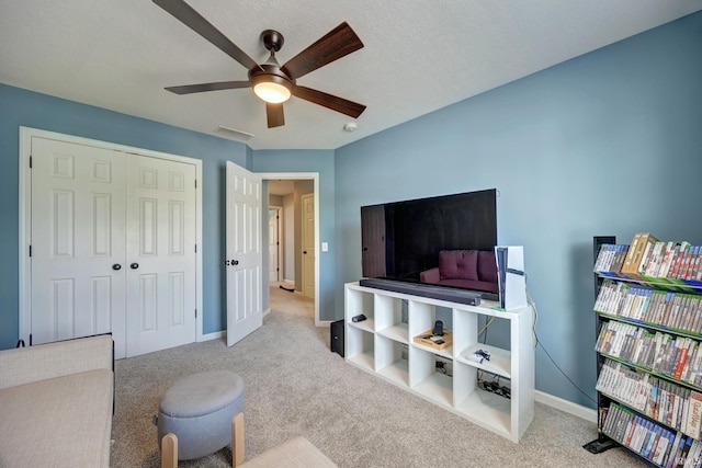 3063 N Natasha Dr, Bloomington, IN 47404 - carpeted living area featuring a ceiling fan and baseboards