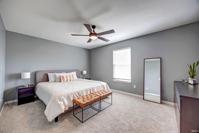 3063 N Natasha Dr, Bloomington, IN 47404 - bedroom featuring light colored carpet, baseboards, and a ceiling fan