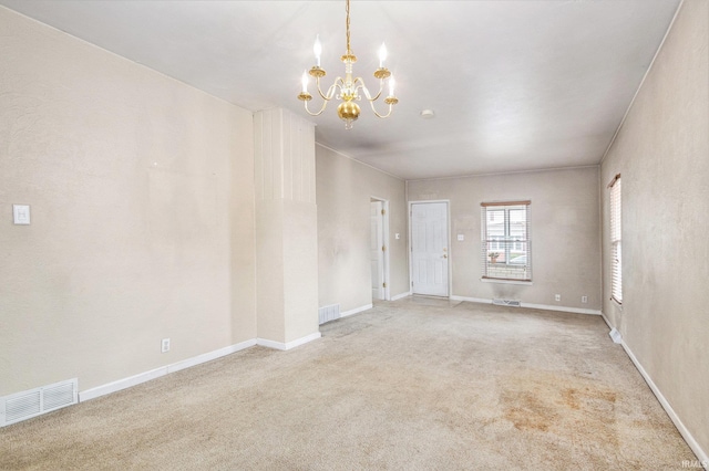 715 W 7th St, Mishawaka, IN 46544 - empty room featuring a chandelier, light colored carpet, and baseboards