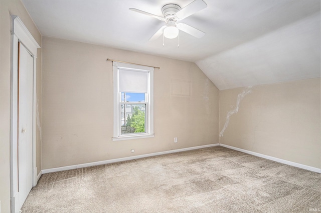 715 W 7th St, Mishawaka, IN 46544 - additional living space with light colored carpet, ceiling fan, lofted ceiling, and baseboards