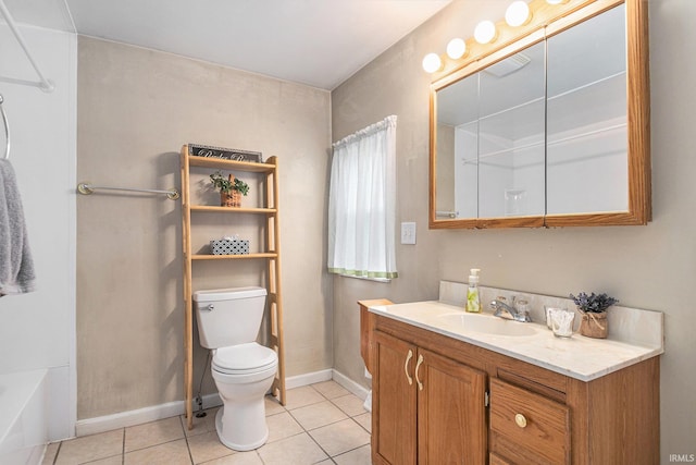 715 W 7th St, Mishawaka, IN 46544 - bathroom with toilet, tile patterned floors, vanity, baseboards, and a tub to relax in