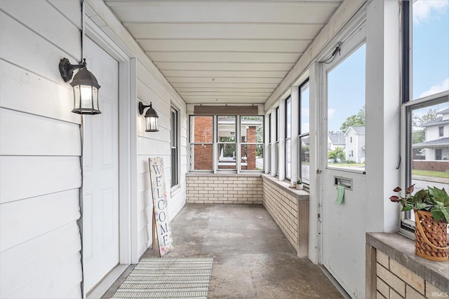 715 W 7th St, Mishawaka, IN 46544 - unfurnished sunroom with concrete flooring