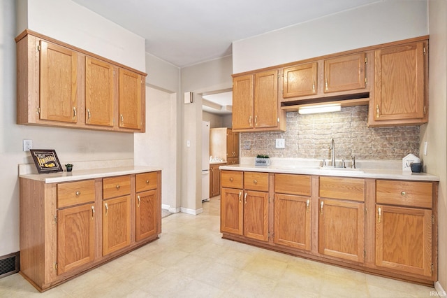 715 W 7th St, Mishawaka, IN 46544 - kitchen with light countertops, backsplash, and light flooring