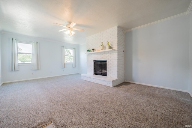 1422 Tam-O-Shanter Ln, Kokomo, IN 46902 - unfurnished living room featuring ceiling fan, a brick fireplace, crown molding, carpet floors, and baseboards
