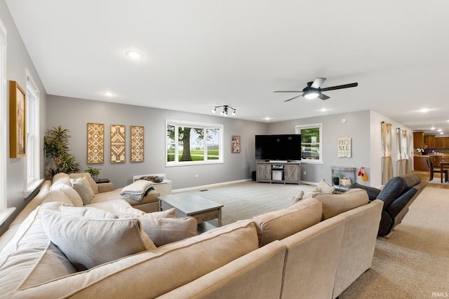 914 W 300 S, Bluffton, IN 46714 - living area featuring light colored carpet, recessed lighting, a ceiling fan, plenty of natural light, and baseboards