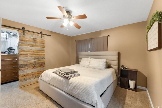 914 W 300 S, Bluffton, IN 46714 - bedroom with light carpet, a barn door, baseboards, and a ceiling fan