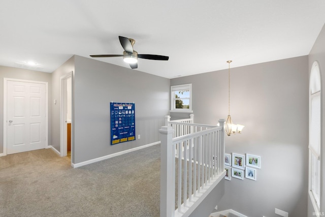 914 W 300 S, Bluffton, IN 46714 - hall with an upstairs landing, baseboards, a chandelier, and carpet floors