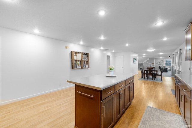 914 W 300 S, Bluffton, IN 46714 - kitchen featuring light wood-style floors, a center island, recessed lighting, light countertops, and baseboards