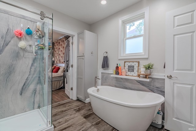 21 Noble St, Wabash, IN 46992 - ensuite bathroom featuring a marble finish shower, wood finished floors, a soaking tub, and recessed lighting