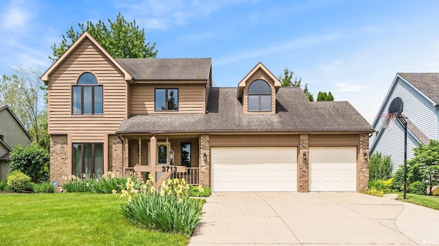 3713 Well Meadow Pl, Fort Wayne, IN 46815 - view of front facade with brick siding, a porch, driveway, a garage, and a front yard