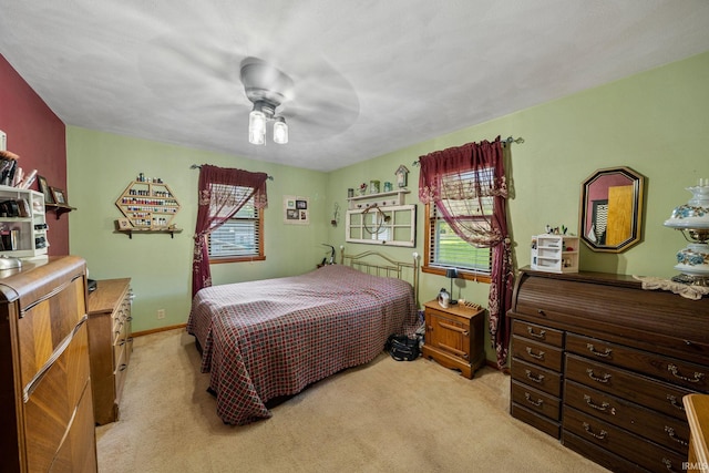 18377 Dunn Rd, South Bend, IN 46637 - bedroom with light colored carpet and a ceiling fan