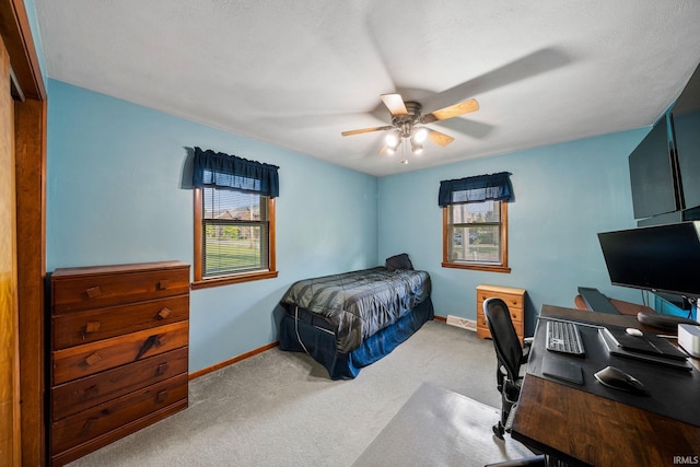 18377 Dunn Rd, South Bend, IN 46637 - carpeted bedroom with an office area, baseboards, and a ceiling fan
