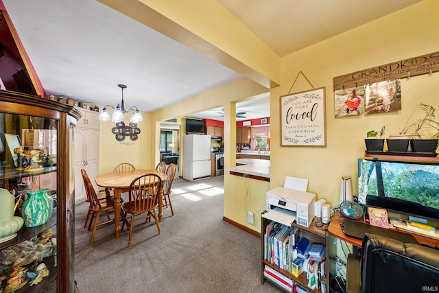 18377 Dunn Rd, South Bend, IN 46637 - dining area featuring a chandelier and light carpet