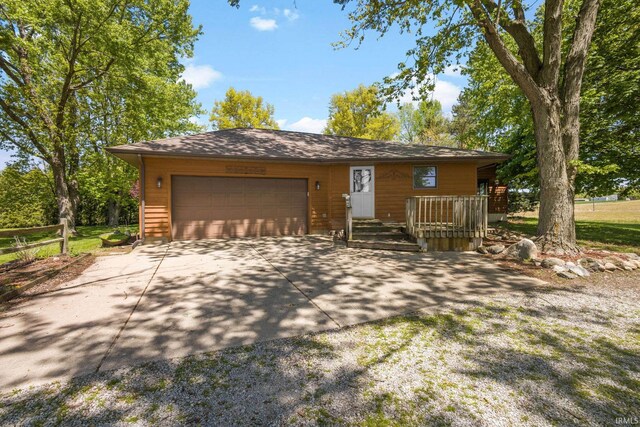 4051 S 700 E, Walkerton, IN 46574 - view of front facade with driveway and an attached garage
