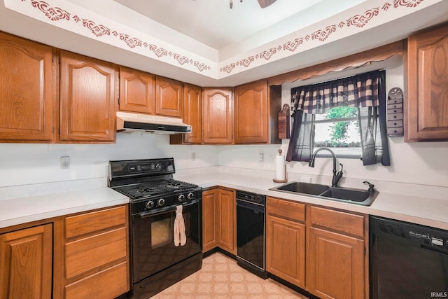 4051 S 700 E, Walkerton, IN 46574 - kitchen featuring black appliances, under cabinet range hood, a sink, light countertops, and brown cabinetry