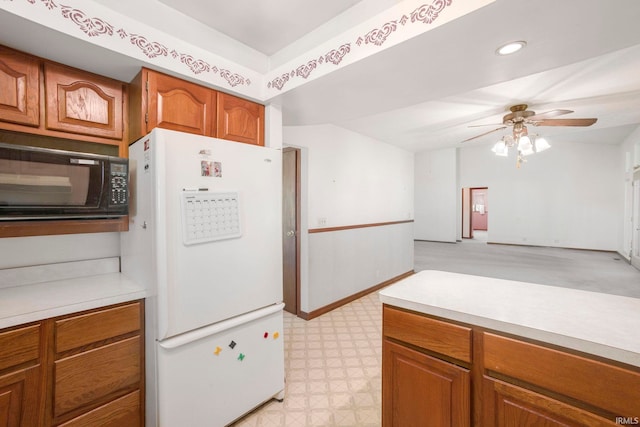 4051 S 700 E, Walkerton, IN 46574 - kitchen featuring freestanding refrigerator, light flooring, brown cabinets, light countertops, and recessed lighting
