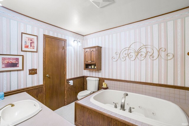 4051 S 700 E, Walkerton, IN 46574 - bathroom with a sink, wallpapered walls, toilet, wainscoting, and a jetted tub