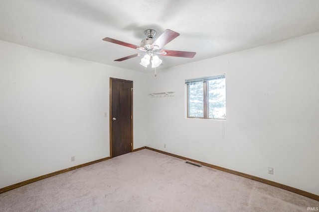 4051 S 700 E, Walkerton, IN 46574 - unfurnished room featuring light colored carpet, baseboards, and a ceiling fan