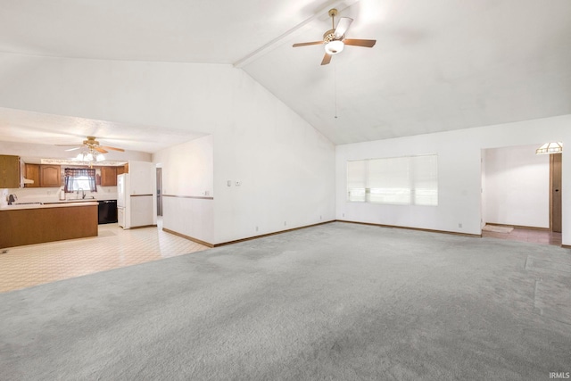 4051 S 700 E, Walkerton, IN 46574 - unfurnished living room featuring ceiling fan, vaulted ceiling, light carpet, a sink, and baseboards