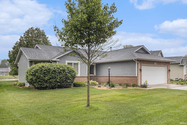 18586 Pauls Way S, Bend, IN 46637 - view of front of house with brick siding, a garage, a front yard, and roof with shingles
