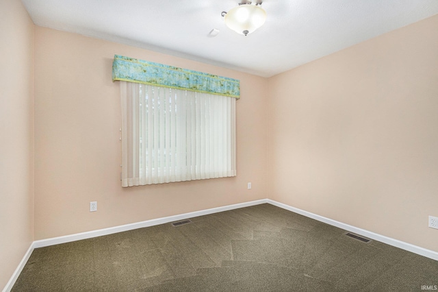 18586 Pauls Way S, Bend, IN 46637 - empty room featuring baseboards and dark carpet