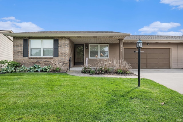 5843 Durham Ct, South Bend, IN 46614 - view of front of home with concrete driveway, a front lawn, a garage, and brick siding